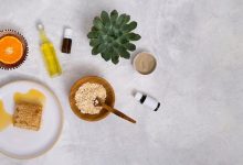 honeycomb-oats-essential-oil-cactus-plant-rhassoul-clay-halved-citrus-fruit-white-concrete-textured-backdrop_23-2148087678-9130876