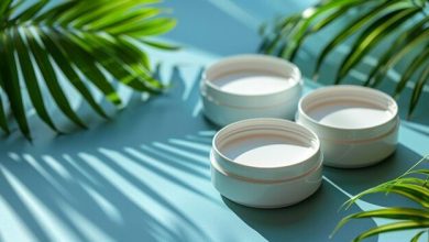 white-cream-jars-blue-background-with-palm-leaves_217507-31150-3872168