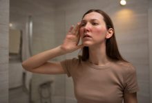 woman-looking-her-rosacea-mirror_23-2150248320-9545570